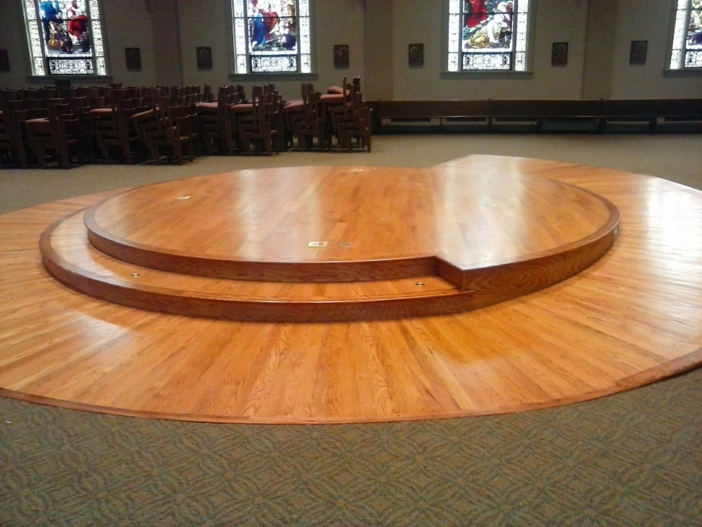 Round wooden stage in the middle of a church